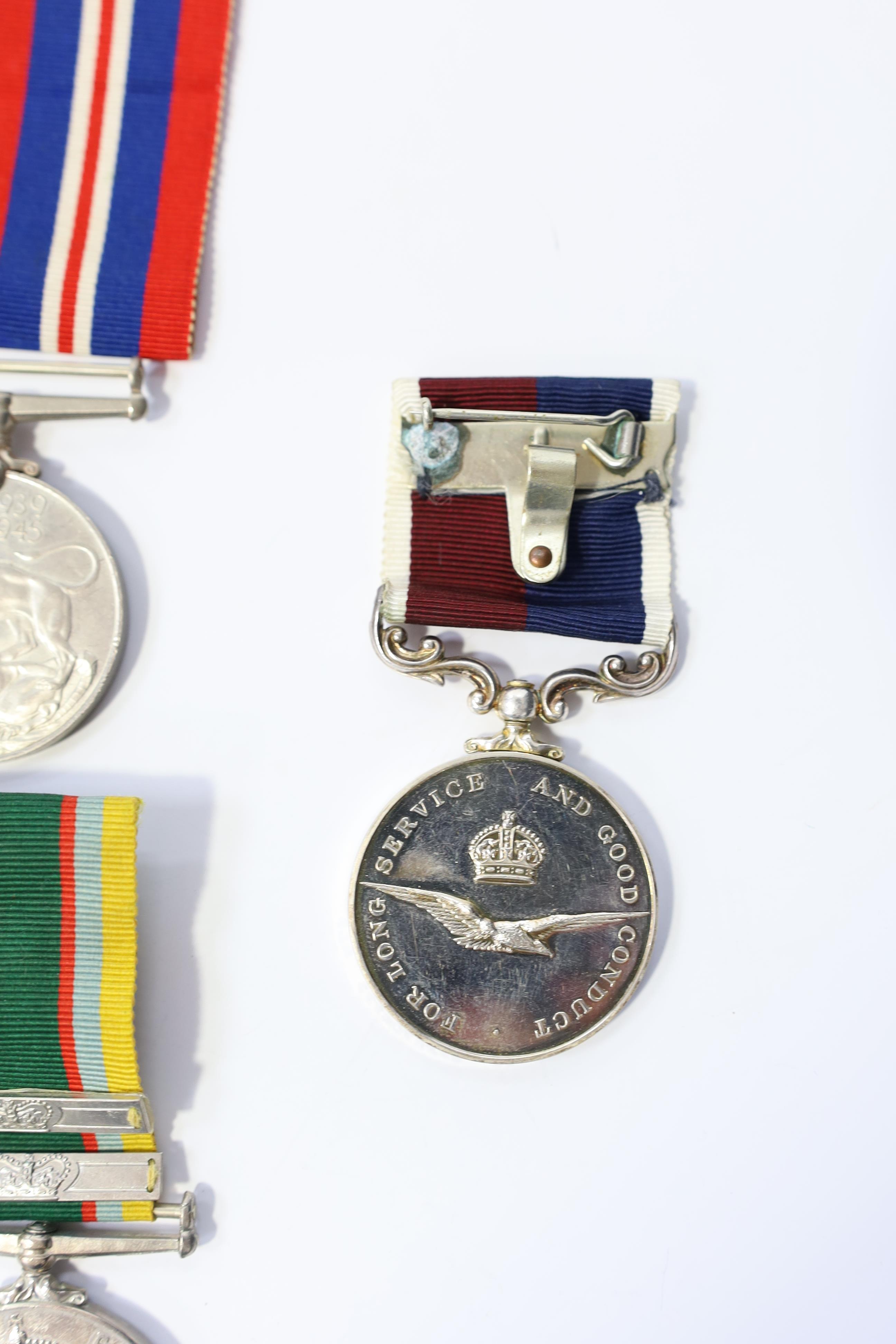 A group of assorted medals; WW2/ERII Cadet Forces medal group of 3 with two clasps to Fg.Off.W.K.Winstone R.A.F.V.R.(T); ERII RAFLSGC to Cpl B.K.Stockwell (F2570477) in box; WW2 Dm & WM. Condition - fair to good.